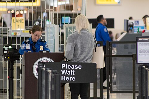 A passenger at an airport security screening checkpoint