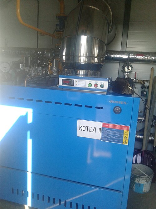 A gas-fired boiler in a boiler room