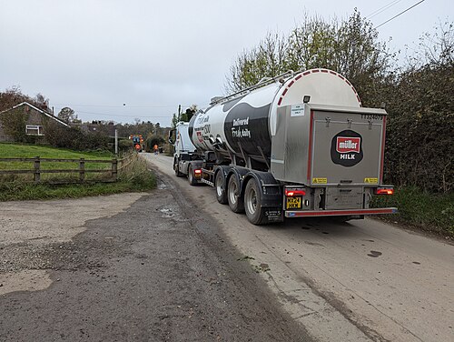 A milk tanker on a farm road