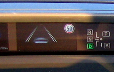 A dashboard showing lane keeping and the speed limit the car read