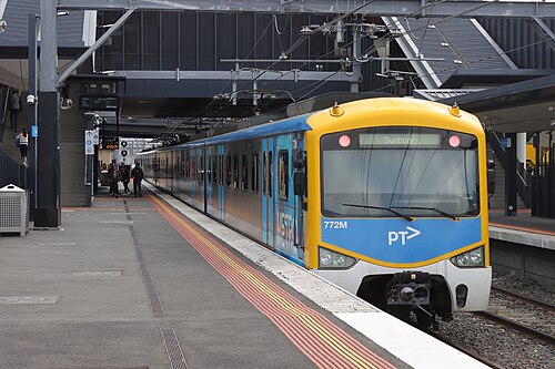 An electric passenger train at a station platform