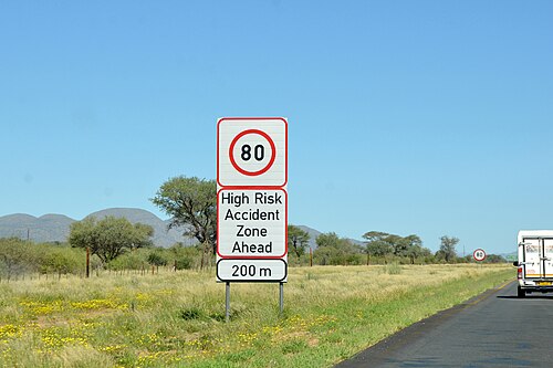 A road sign warning of a high-risk zone ahead